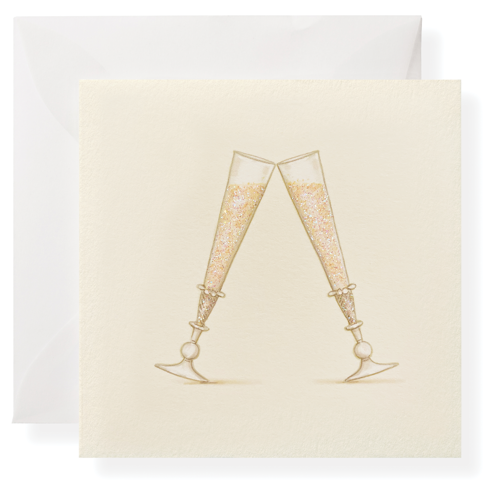 The Karen Adams Just Married Gift Enclosures feature two champagne flutes with gold bubbles clinking on a natural white square card, hand-glittered for a festive touch, paired with a matching white envelope.