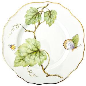 From the Garden Leaves Dinnerware Collection by Anna Weatherley, this white porcelain plate features hand-painted green leaves, a yellow beetle, a colorful butterfly, and an elegant gold-rimmed edge.