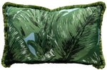 The Beverly Hills Green on Sky Outdoor Lumbar Pillow by Hive Custom Pillows is handmade in the USA, showcasing a tropical leaf pattern in vibrant green with elegant ruffled edges for style and comfort.