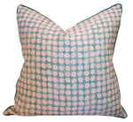 The Boheme Pink and Celadon Pillow by Hive Custom Pillows is handmade in the USA with a geometric pattern of white and light pink circles on a turquoise background.