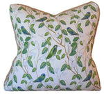 The Hummingbirds White Pillow by Associated Design features a handmade design with green leaves and blue-green hummingbirds on branches against a white background.