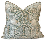 The Shell Grotto Green/Tan Pillow by Hive Custom Pillows features a square design with seashell, floral, and circular patterns in green, beige, and white—crafted from premium materials for a stylish accent.