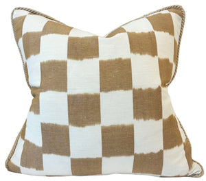 The Checkerboard Toffee Pillow by Hive Custom Pillows features a tan and white checkered design with braided edging, photographed against a white background.
