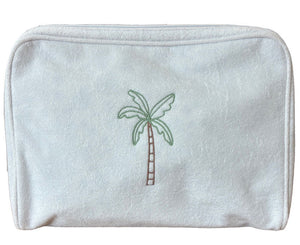 The Large Palm Toiletry Bag by Weezie Towels is a stylish, washable white pouch featuring a minimalist embroidered palm tree and zippered closure—perfect for multiple uses.