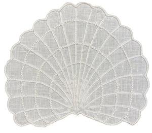 Haute Home's Shell Coaster Set features white, fan-shaped lace coasters with scalloped edges and embroidered lines and dots, ideal for adding a coastal touch to your home décor.