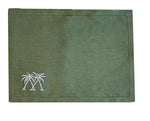 The Coastal Linen Placemat Set by Pink House Mustique features green linen with a stitched border and two white embroidered palm trees—an ideal way to bring a beach-inspired touch to your dining space.
