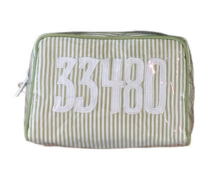 The Walker Valentine Milan Cosmetic Case features green and white vertical stripes with "33480" stitched in large white numbers—a stylish choice for travel.