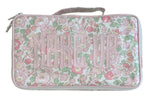 The Walker Valentine Handled Brush and Makeup Case is a rectangular bag with a floral pink, green, and white pattern and "MAKE UP" on the front—ideal as a travel case for organizing brushes and essentials.