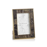 From the Zodax Natural Horn with Brass Trim Frame Collection, this rectangular photo frame features a dark, textured horn border with unique patterns and elegant brass trim, displayed upright with a "ZODAX" placeholder inside.