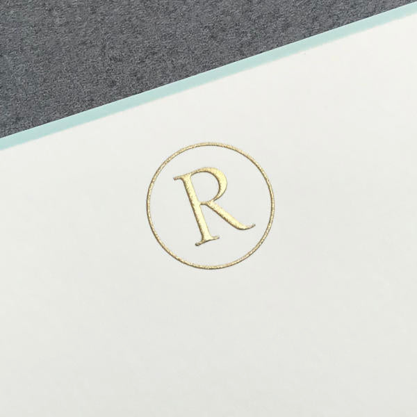 The upper part of the image features Printery's Initial Card Set: a white card with an aqua border, displaying a gold letter "R" inside a circle, set against a gray background.