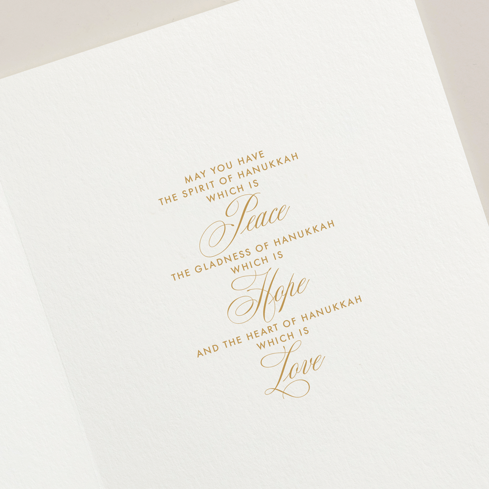 The Lights of Hanukkah Card Set by Crane features gold embossed text and a shimmering menorah, wishing you peace, hope, and love this season.
