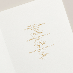 The Lights of Hanukkah Card Set by Crane features gold embossed text and a shimmering menorah, wishing you peace, hope, and love this season.