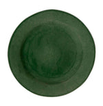 The Juliska Puro Basil Dinnerware Collection features a round, verdant green ceramic plate photographed from above on a white background, highlighting its artisanal beauty.