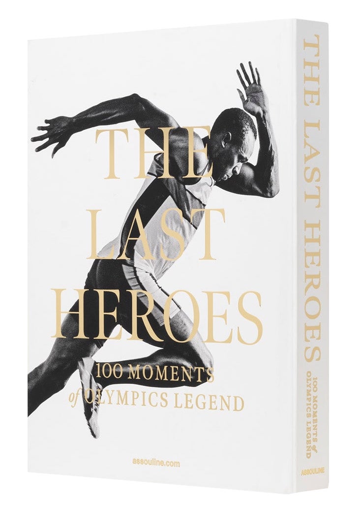 Cover of the book "The Last Heroes: 100 Moments of Olympics Legend" by Assouline, featuring a black and white photo of a sprinter in motion. This compelling homage to Summer Olympics history captures the essence of athletic heroism.