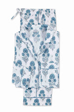 The Matouk Luca Pajama Set features a folded white cotton percale design with blue floral print, including a button-up collared top with front pocket and matching drawstring pants.