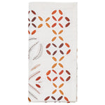 The Kim Seybert Malta Napkin Set features white napkins with embroidered red, orange, and brown leaf patterns and cutwork-inspired cut-out details along one side.