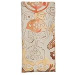 The Giverny Napkin Set by Kim Seybert features folded rectangular linen napkins with a beige background and Monet-inspired abstract floral patterns in orange, brown, and tan tones.