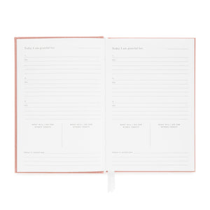The Sugar Paper Gratitude Rose Journal features open pages with prompts for daily appreciation, intentions, and reflections—a perfect spot for your daily check-in and mindful gratitude practice.
