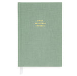 The Sugar Paper Gratitude Sage Journal is a green hardcover with "DAILY GRATITUDE JOURNAL" embossed in gold. Ideal for daily check-ins, it features a white ribbon bookmark for easy access.