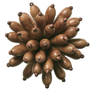 The Kim Seybert Florette Brown Napkin Ring features elongated brown pods in a radiating design, evoking natural elegance—ideal for enhancing outdoor gatherings.