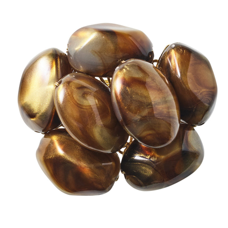 The Kim Seybert Bonton Napkin Ring features a cluster of shiny, irregular amber brown marbleized beads arranged closely together, shown against a white background.