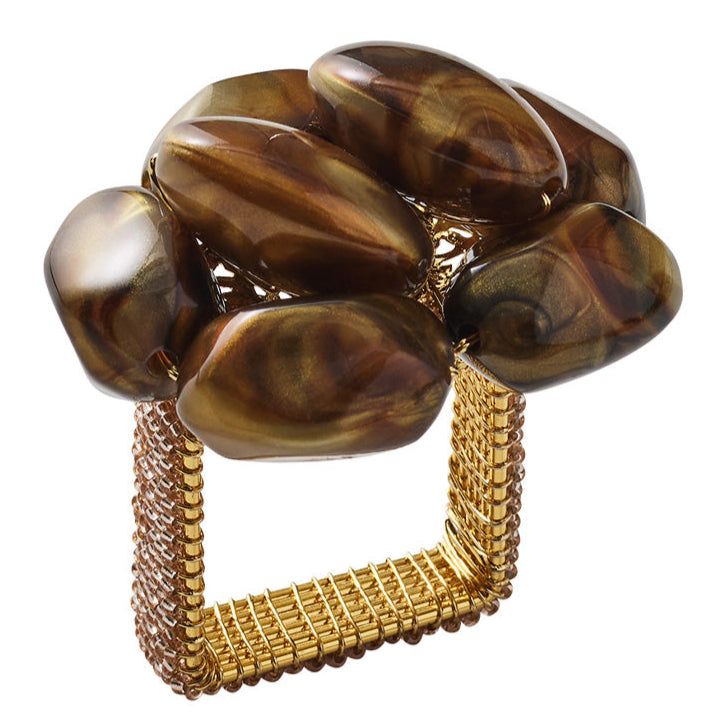 The Kim Seybert Bonton Napkin Ring features a square shape, a woven gold band, and abstract clusters of polished amber brown and gold marbleized beads.