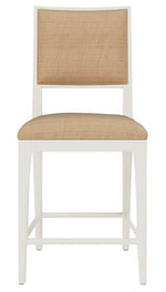 Introducing the Nelton Dining Chair by Made Goods: a modern masterpiece featuring a white wood frame and four sturdy legs. Crafted from oak, it boasts a natural raffia cushioned seat and backrest, ensuring both style and comfort.