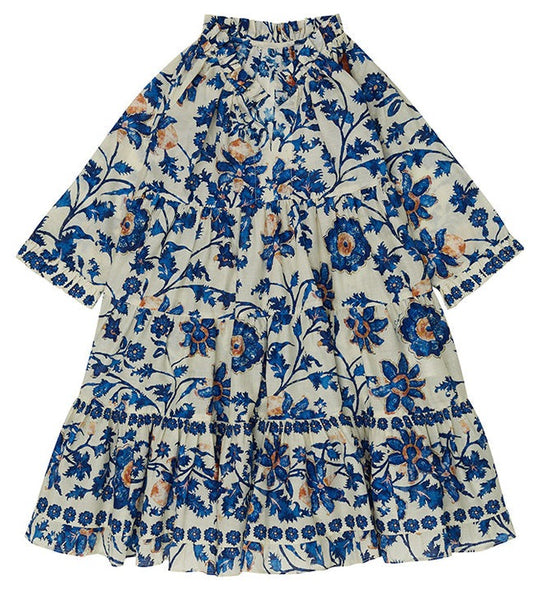 A cotton voile Cara Cara Girls' Nora Dress with Alexandria floral print, featuring blue and orange patterns on a white background, laid flat to display its tiered skirt and flowing sleeves.