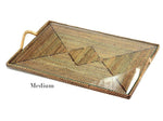 The Calaisio Rectangular Tray with Glass Bottom Collection features a medium-sized woven tray with a single side handle and a rustic modern diamond pattern.