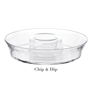 The Juliska Puro Glass Serveware Collection chip and dip platter features elegant textural lines, a central dip compartment, and a surrounding area for chips.