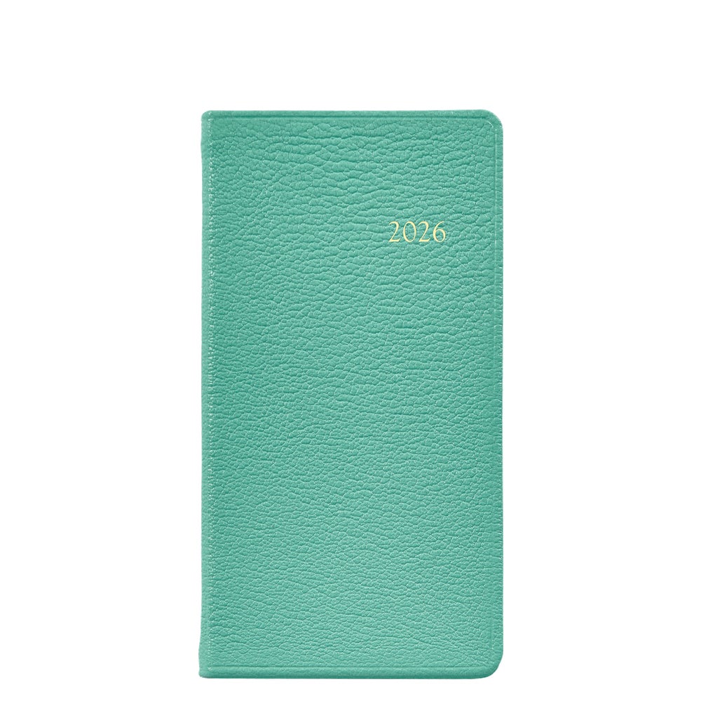 The 2026 Pocket Journal Planner Collection by Graphic Image features a teal textured hardcover pocket journal with "2026" gold-embossed on the front, Smyth sewn for durability, displayed against a white background.