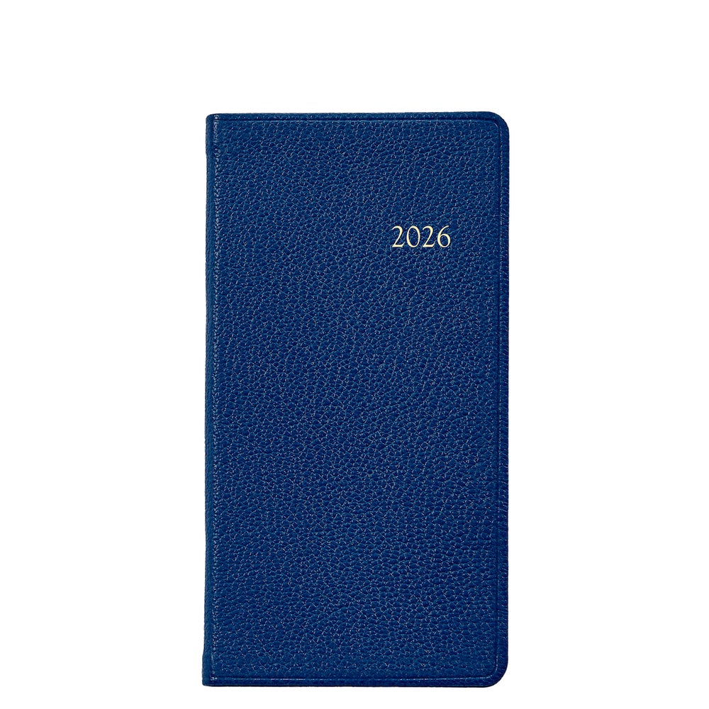 The Graphic Image 2026 Pocket Journal Planner Collection features a blue leather-bound personal journal with "2026" embossed in silver on the front cover, shown closed against a white background.