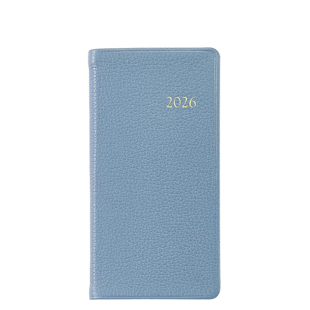 A light blue, textured, Smyth sewn hardcover from the Graphic Image 2026 Pocket Journal Planner Collection features "2026" embossed in gold on the front.