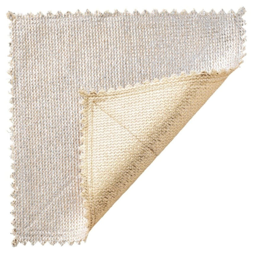 The Kim Seybert Silver & Gold Stamped Reversible Placemat features a luxurious woven texture and scalloped edges—partially folded to display its elegant, reversible design, perfect for elevating any table setting.