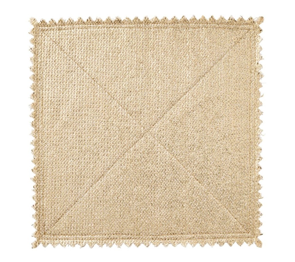 The Kim Seybert Silver & Gold Stamped Reversible Placemat features a luxurious woven texture with metallic accents and zigzag edges, adding elegance and style to any table setting.