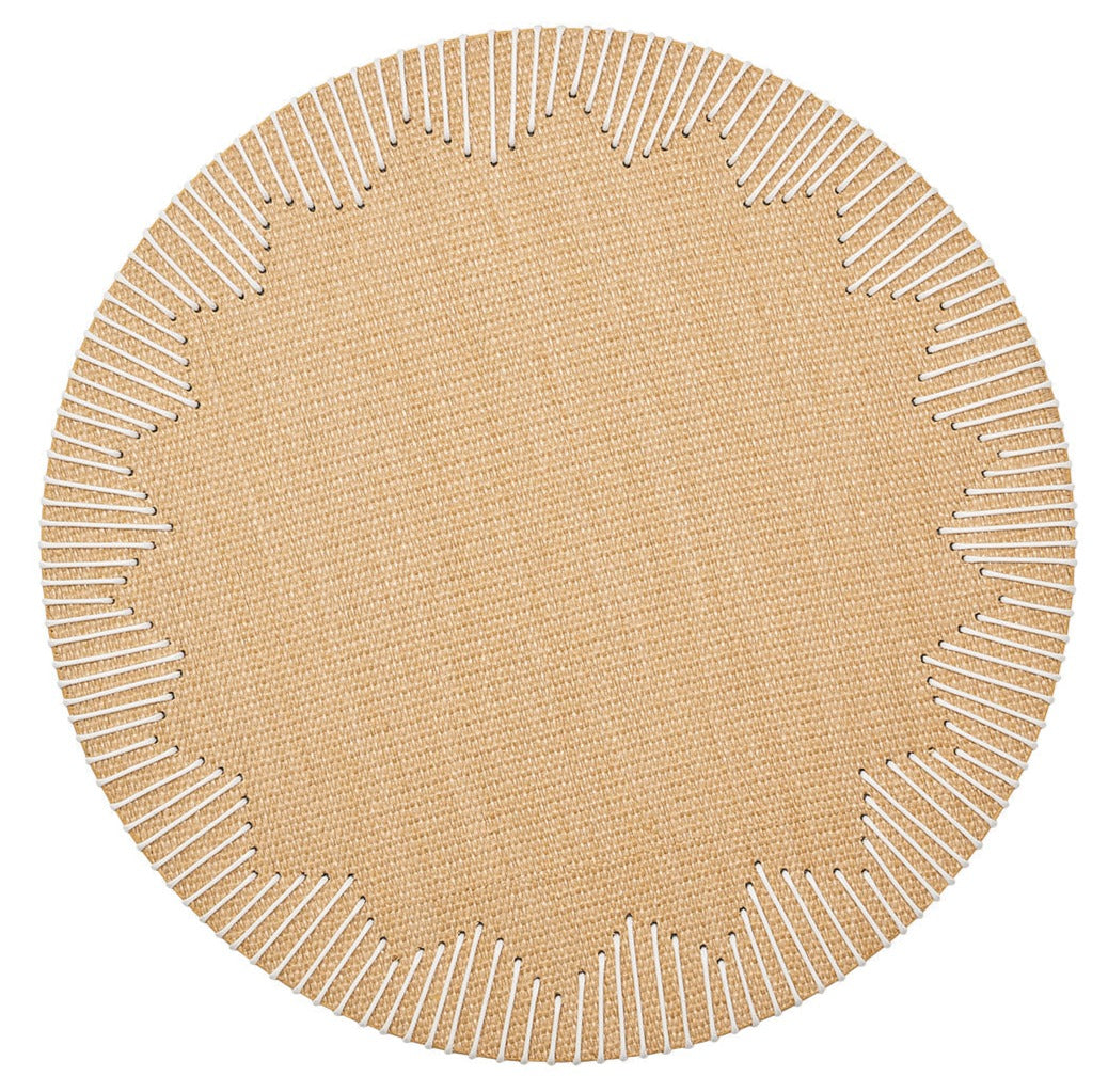 The Kim Seybert Dream Weaver Placemat features a round beige design with scalloped edges and white stitched accents radiating inward, making it a chic choice for stylish summer entertaining.