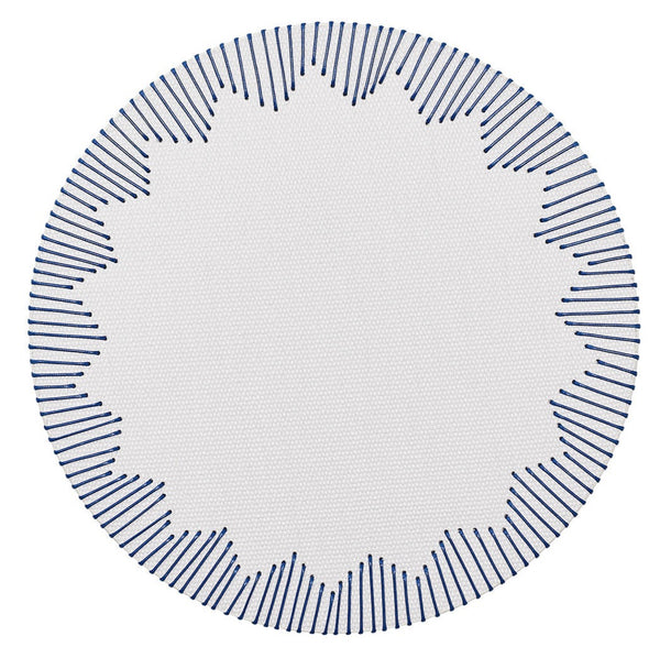 Round Kim Seybert Dream Weaver placemat with a blue fringe pattern on the edges.