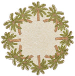 The Kim Seybert Oasis Placemat features a round, textured design with embroidered green palm trees and subtle beading, making it perfect for tropical entertaining.