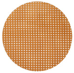 The Kim Seybert Reed Placemat features woven cane webbing with a hexagonal lattice pattern, offering a faux-wicker look that's ideal for outdoor entertaining on a white background.