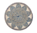 Inspired by the Kim Seybert Majorelle Placemat, this round woven basket lid is crafted from natural seagrass and showcases a geometric blue and white pattern when viewed from above.