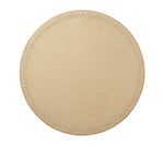 The Starry Night Placemat Collection by Kim Seybert features a round, beige leather coaster with metallic trim and visible stitched edges. Photographed on a white background, it offers effortless cleaning while adding style to your table.