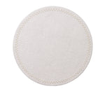 The Starry Night Placemat Collection by Kim Seybert features a round, white textured placemat with a subtle stitched border and metallic trim, adding an elegant, easy-to-clean touch to any table setting.