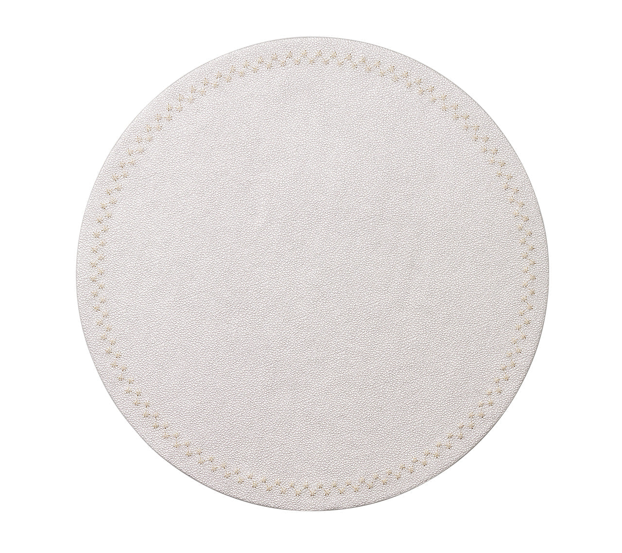 The Starry Night Placemat Collection by Kim Seybert features a round, white textured placemat with a subtle stitched border and metallic trim, adding an elegant, easy-to-clean touch to any table setting.