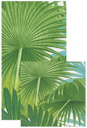 The Caspari Palm Fronds White Collection features large green palm leaves, celebrated for their eco-friendly and biodegradable qualities, overlapping on a background with touches of blue sky and greenery.