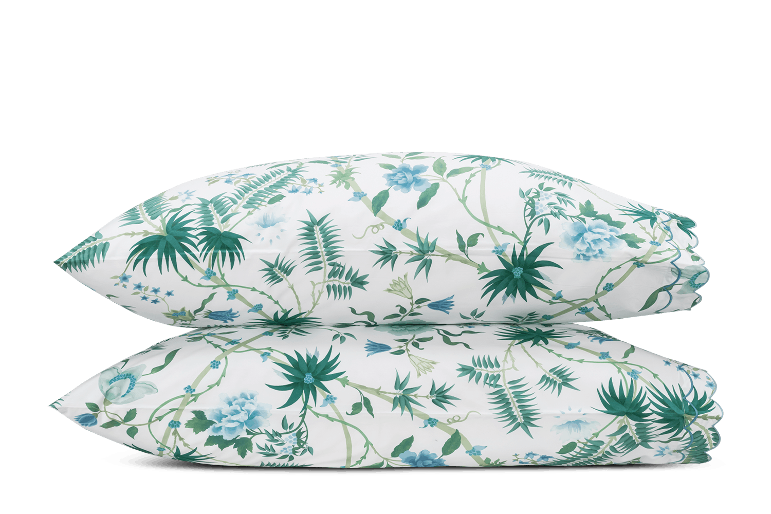 Two stacked pillows from the Matouk Palmyra Bedding Collection in Emerald, featuring a green and blue botanical print on white—perfect for adding a touch of tropical style to your bedding.
