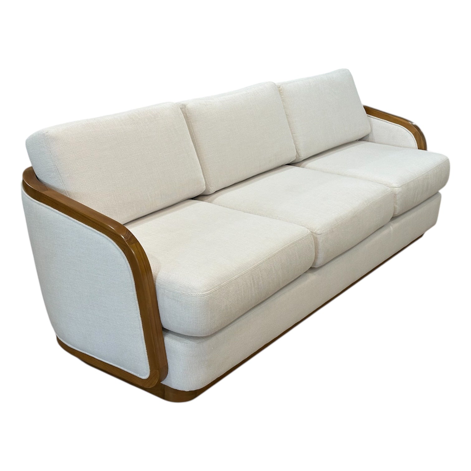 The Schooner Sofa in Outdoor Ivory Chenille by McGuire Furniture is a three-seater with curved wooden armrests and frame, upholstered in light beige for a natural, coastal-inspired look.