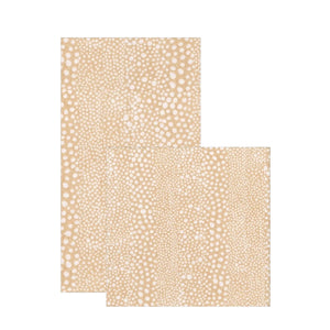 Two rectangular napkins from Caspari's Pebble Beige Paper Linen Collection, one larger and one smaller, overlap slightly. Both feature a dense white dot pattern and are fully compostable and biodegradable.