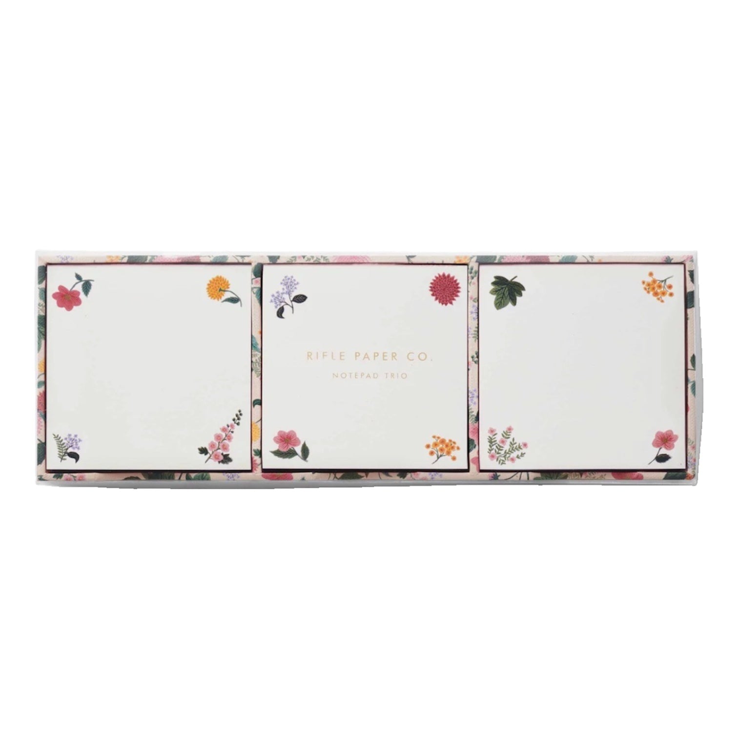 A boxed set from Riffle Paper Co.’s Dahlia Collection includes three square notepads featuring elegant floral designs, called the "Notepad Trio.