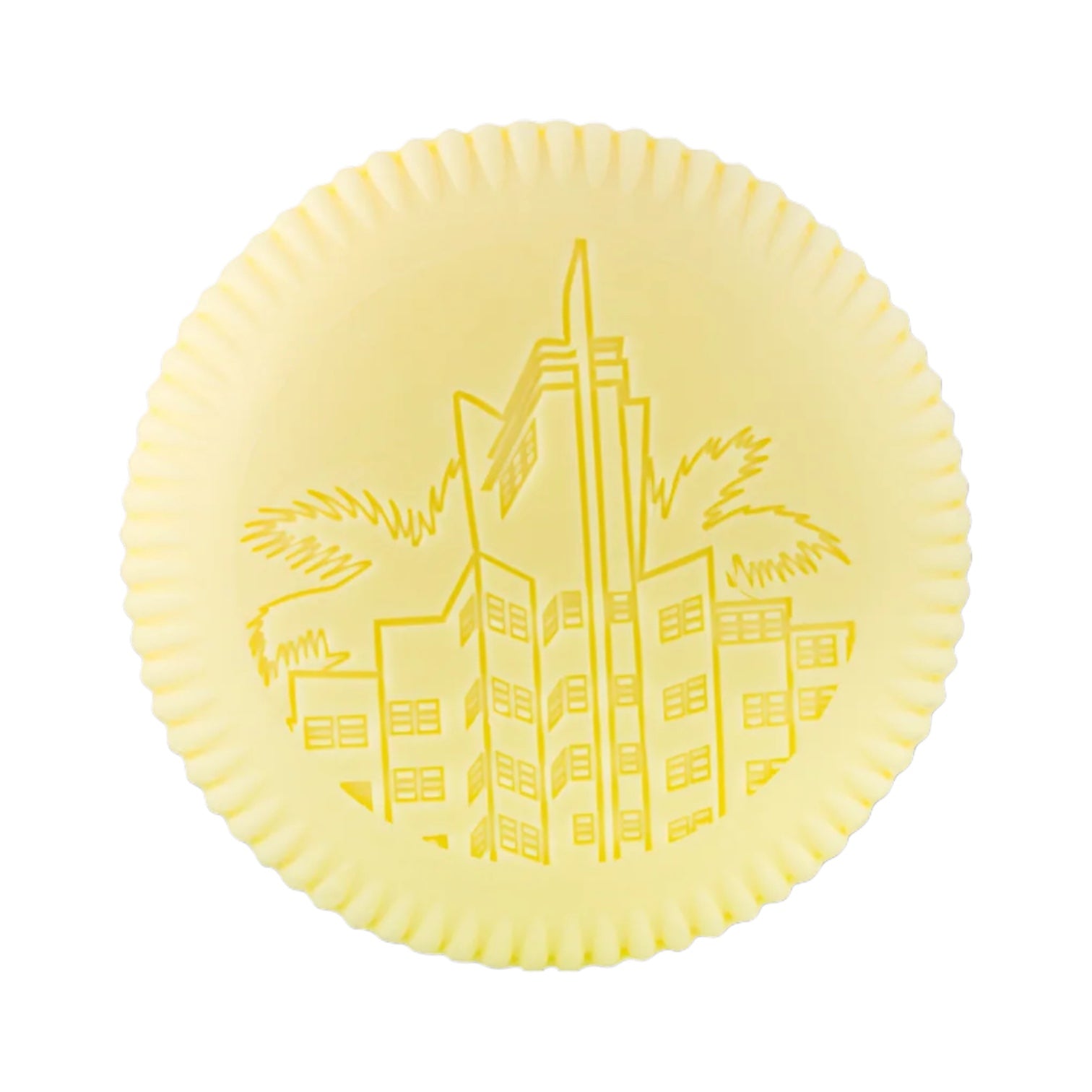 The Baobab Collection Miami Body Wellness Collection features a round yellow plate with a scalloped edge embossed with an Art Deco building and palm trees, capturing the lively spirit and summer fragrance of Miami.