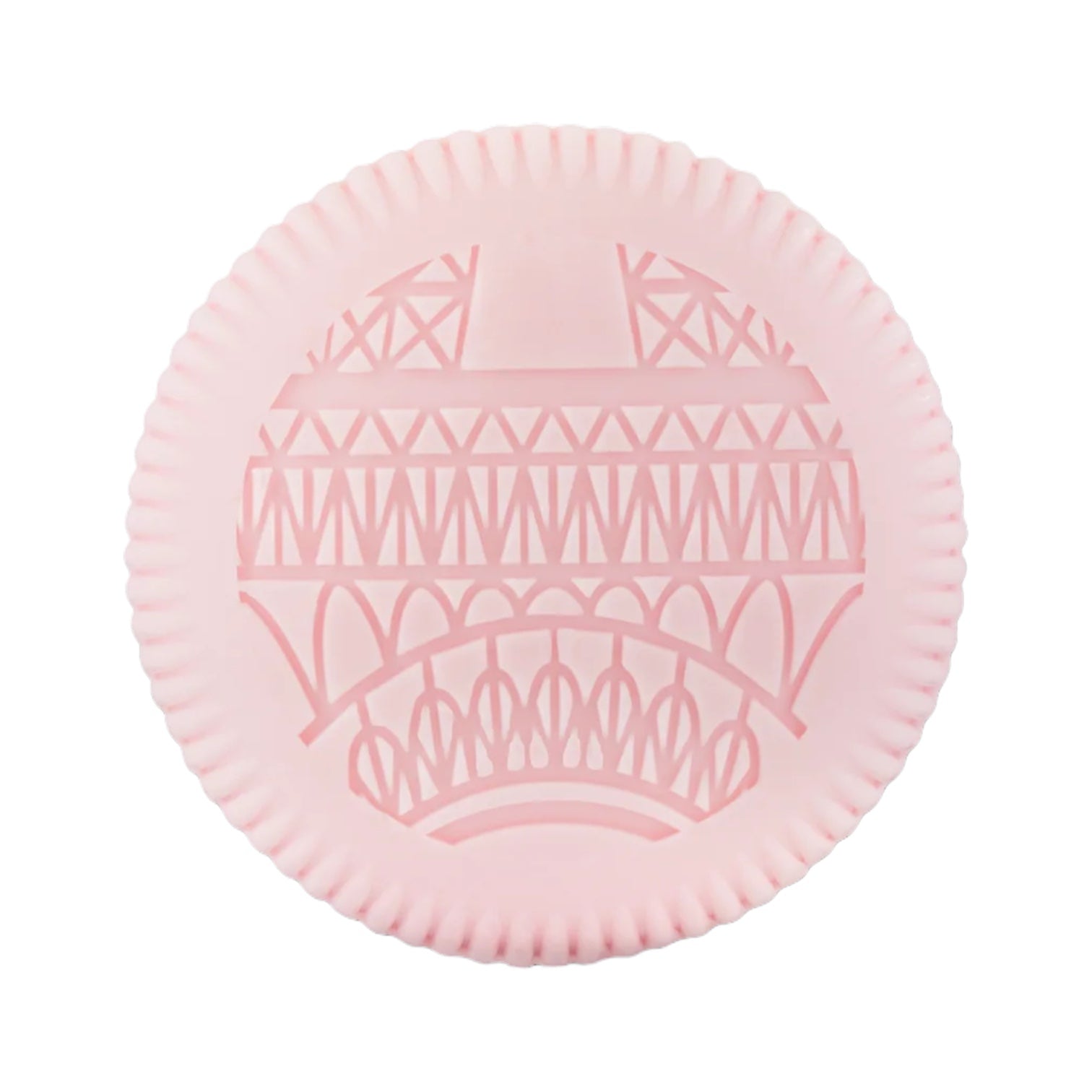A round, pink item from Baobab's Paris Body Wellness Collection, with a raised Eiffel Tower pattern and ridged edge—blending Parisian charm, delicate chestnut blossom, and refined fragrance.